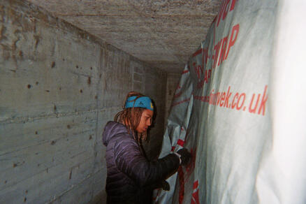 My little brother helping me put up the frames and the vapor barrier.