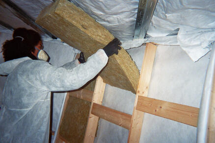 Putting rockwool in the wooden frames.